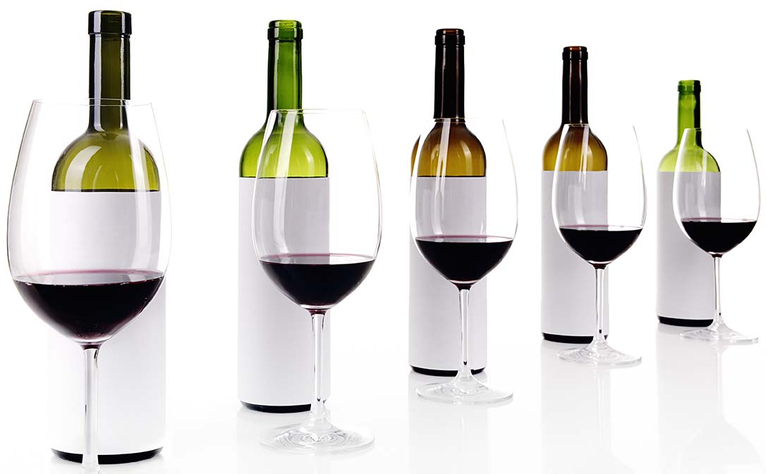 Wine bottles covered in white paper, prepared for a "blind" wine tasting